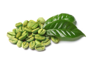 Green coffee beans and fresh leaves on white background